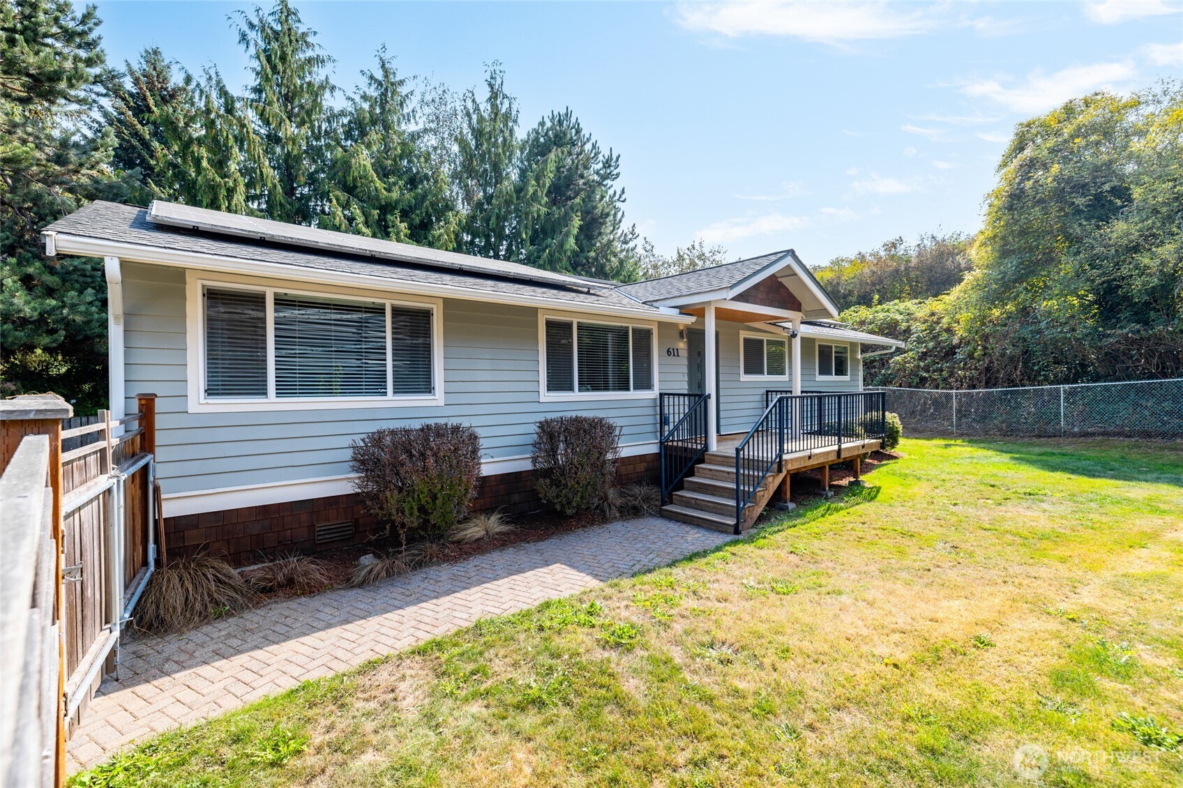 611 Whatcom Street La Conner, WA 98257 - Photo 22 of 26 a view of a house with a yard and furniture