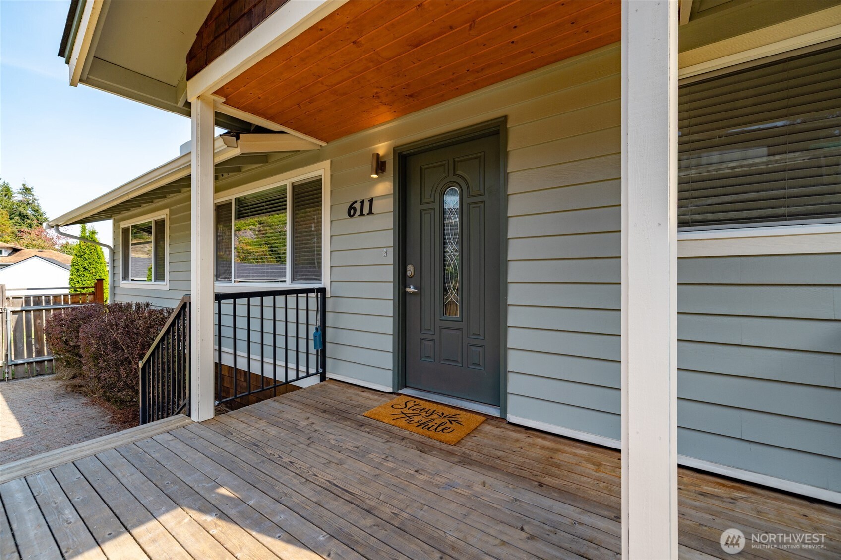 611 Whatcom Street La Conner, WA 98257 - Photo 25 of 26 a view of a house with wooden deck