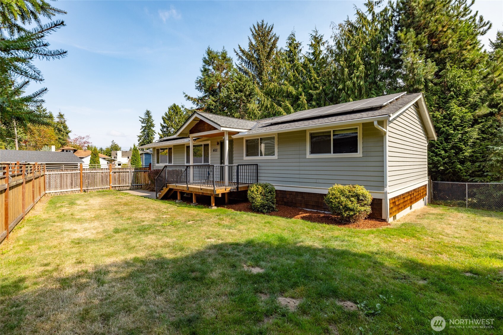 611 Whatcom Street La Conner, WA 98257 - Photo 26 of 26 a view of a house with a yard and sitting area
