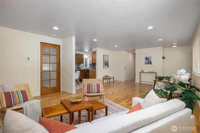 a living room with furniture and white walls