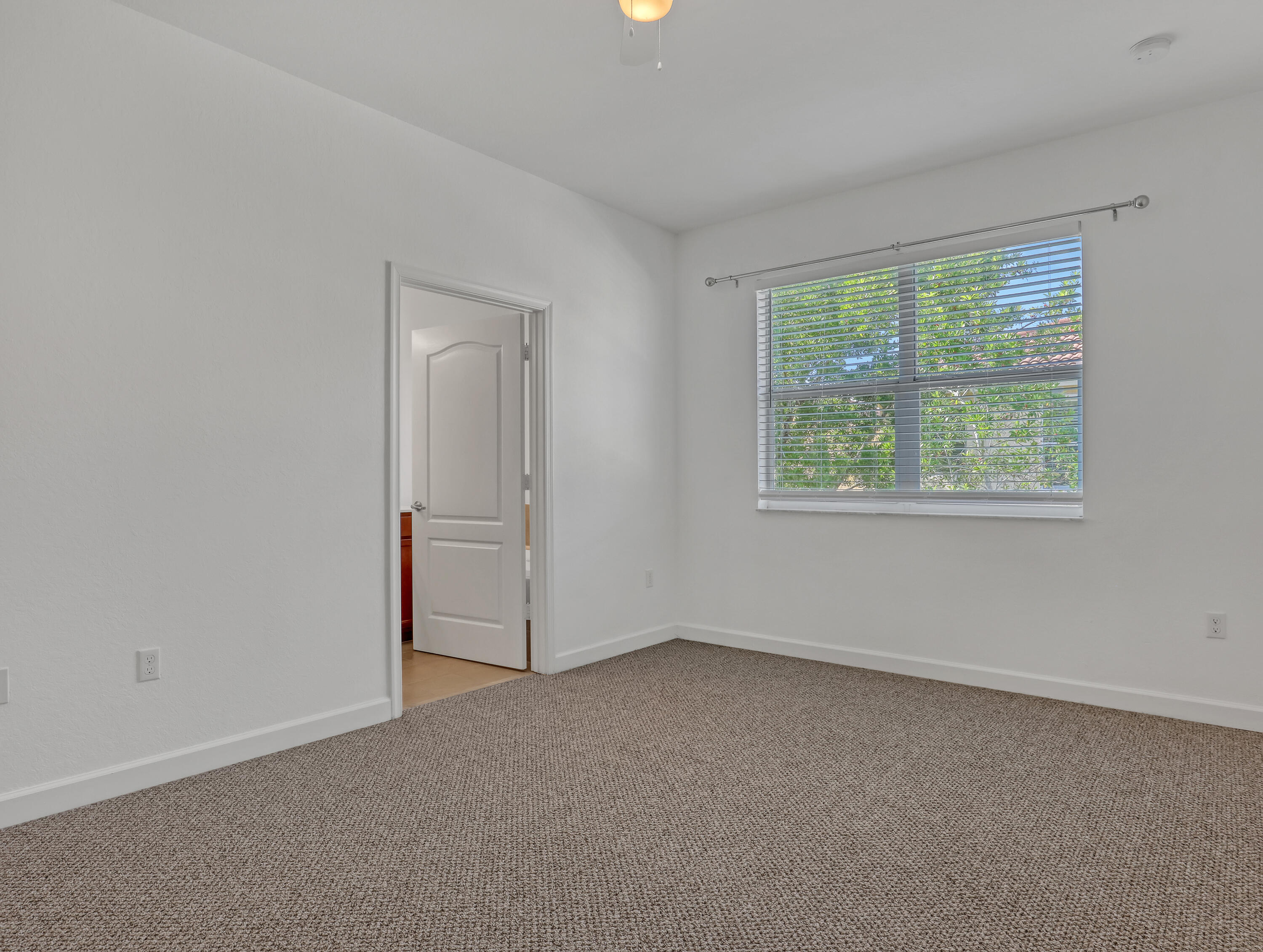 9508 Southwest Otter Lane Stuart, FL 34997 - Photo 19 of 34 an empty room with windows