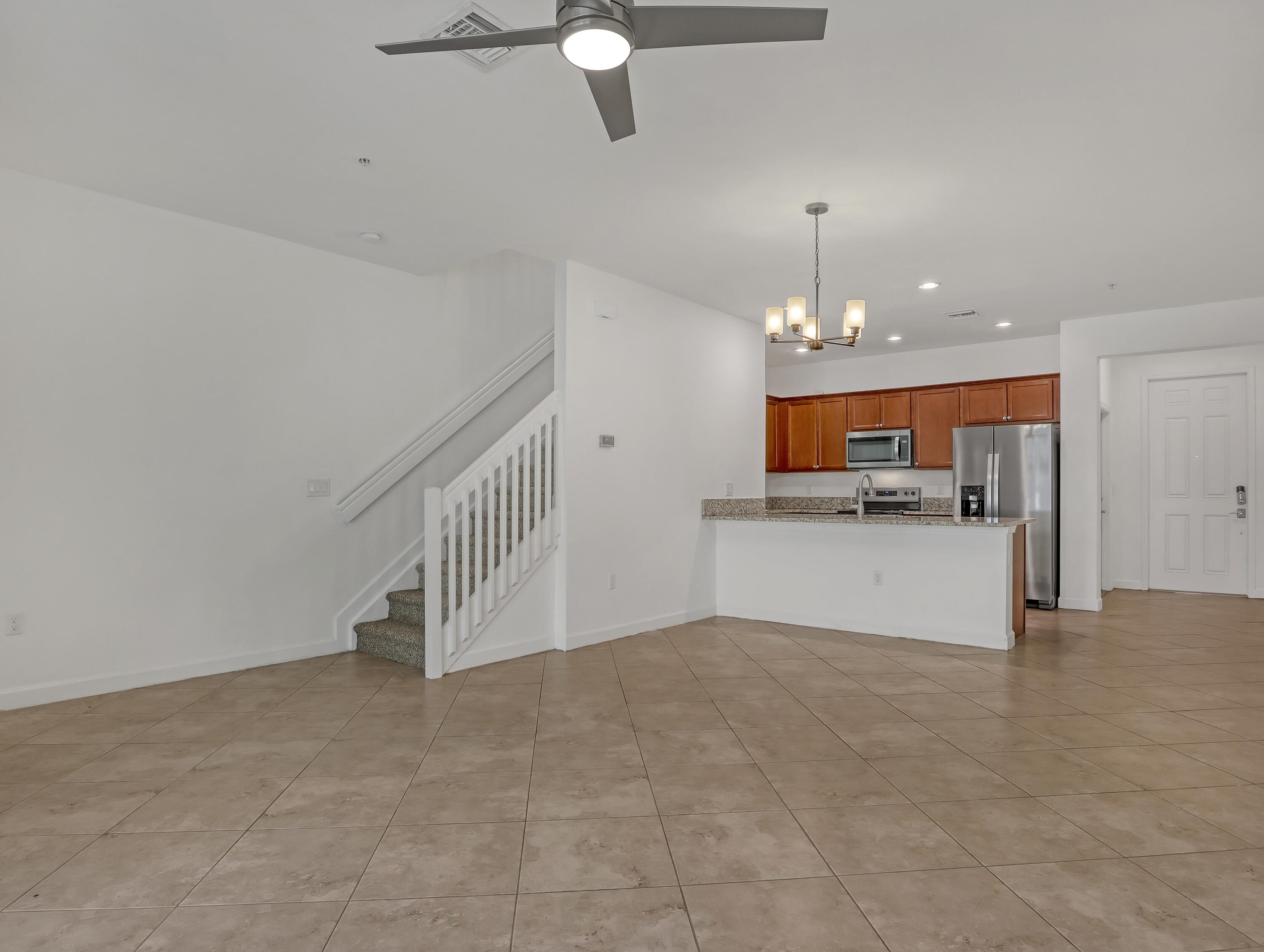 9508 Southwest Otter Lane Stuart, FL 34997 - Photo 10 of 34 a view of kitchen and kitchen with microwave