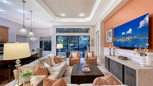 a kitchen with granite countertop cabinets a sink a dining table and chairs
