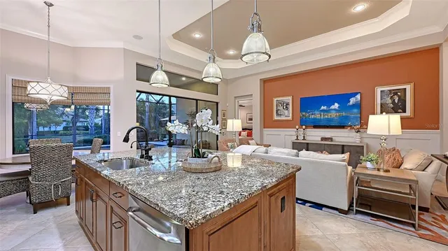 a bathroom with a granite countertop sink a vanity and a large mirror
