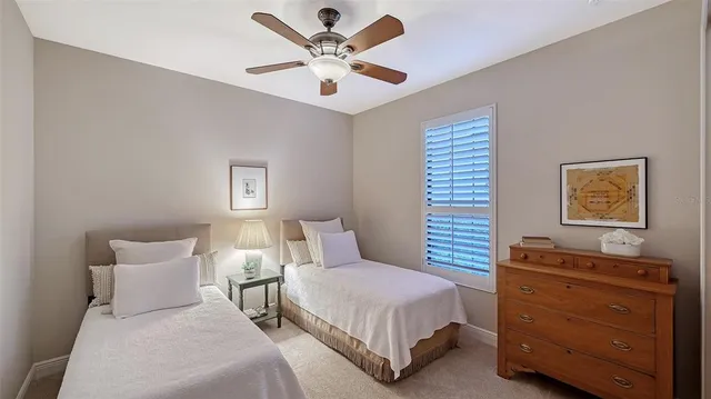 a view of a backyard with a tub and wooden fence