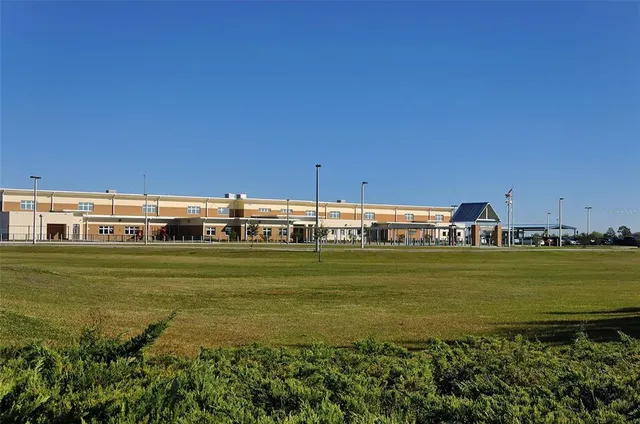 a view of a swimming pool with a yard