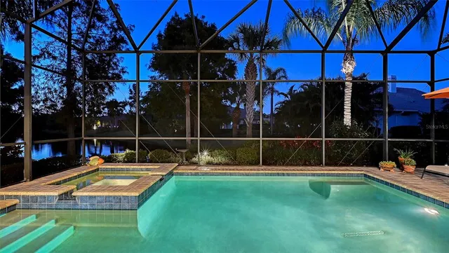 a living room with furniture and a view of kitchen
