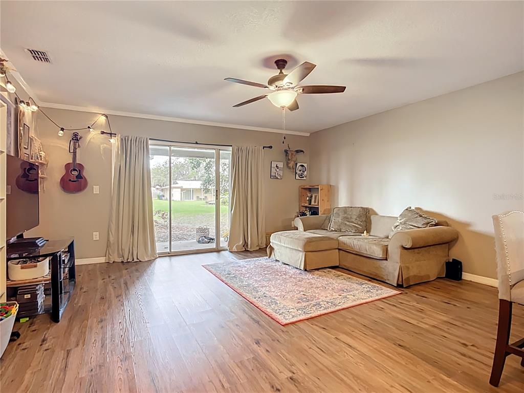 1304 Alfred Street, Unit B Brandon, FL 33510 - Photo 11 of 26 a living room with furniture and a large window