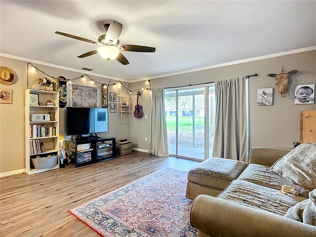 1304 Alfred Street, Unit B Brandon, FL 33510 - Photo 12 of 26 a living room with furniture and a flat screen tv