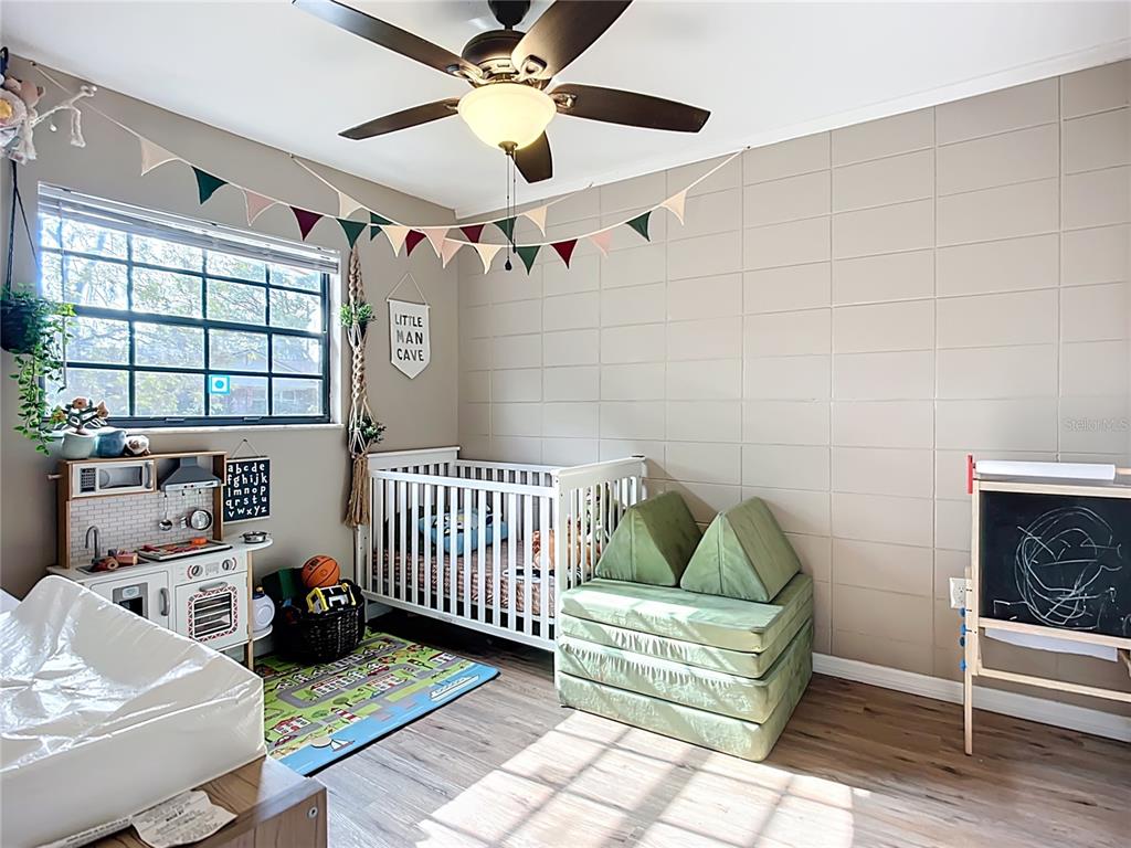 1304 Alfred Street, Unit B Brandon, FL 33510 - Photo 14 of 26 a bedroom with furniture and a window