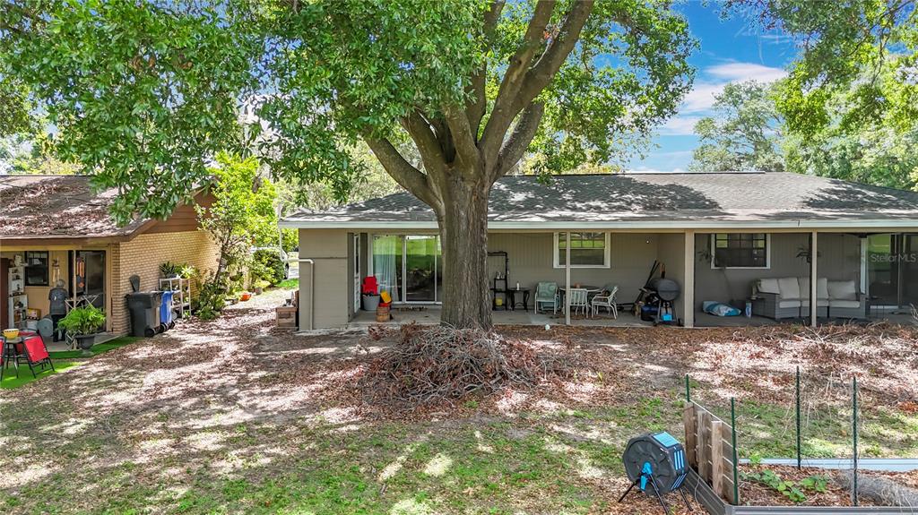 1304 Alfred Street, Unit B Brandon, FL 33510 - Photo 22 of 26 a view of a house with backyard sitting area and garden