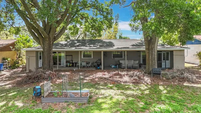 a view of a house with garden and balcony
