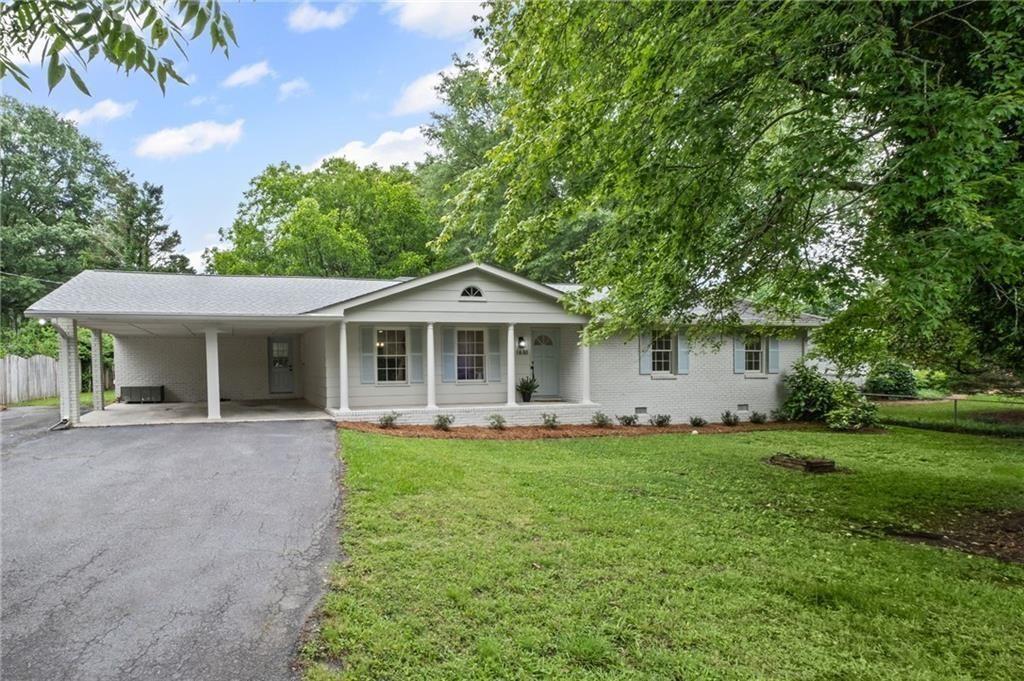 1830 Mayfield Road Alpharetta, GA 30009 - Photo 1 of 1 a front view of a house with a garden