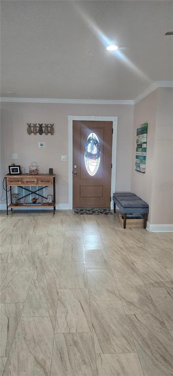 538 Crystal Drive Madeira Beach, FL 33708 - Photo 2 of 21 a living room with furniture and a window