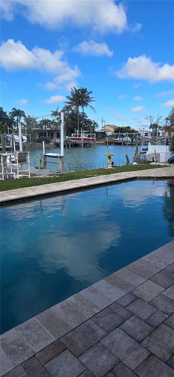 538 Crystal Drive Madeira Beach, FL 33708 - Photo 4 of 21 a view of a lake with houses
