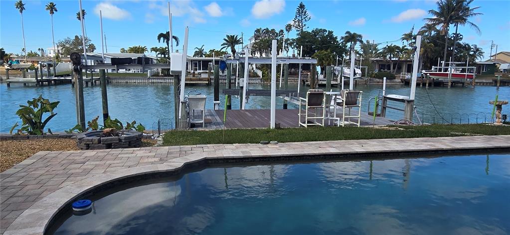 538 Crystal Drive Madeira Beach, FL 33708 - Photo 5 of 21 a view of a lake with boats and palm trees