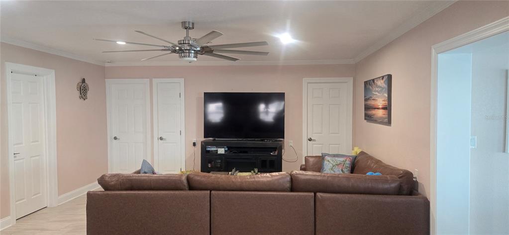 538 Crystal Drive Madeira Beach, FL 33708 - Photo 9 of 21 a living room with furniture and a flat screen tv