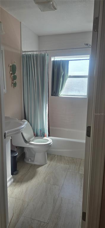 538 Crystal Drive Madeira Beach, FL 33708 - Photo 10 of 21 a bathroom with a toilet and a shower