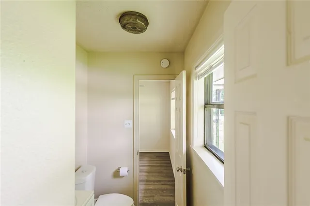 a bathroom with a granite countertop sink and a shower