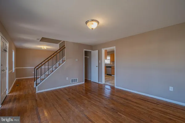 a view of an entryway with wooden floor
