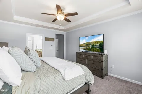 a bathroom with a granite countertop double vanity sink and a mirror