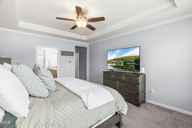a bathroom with a granite countertop double vanity sink and a mirror