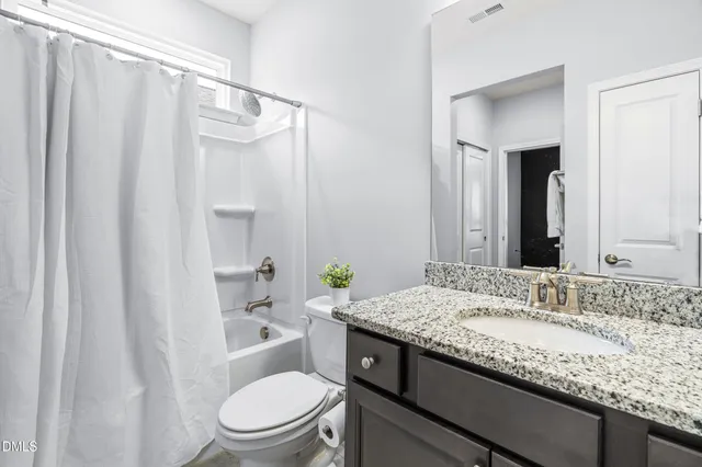 a room with gym equipment and a window