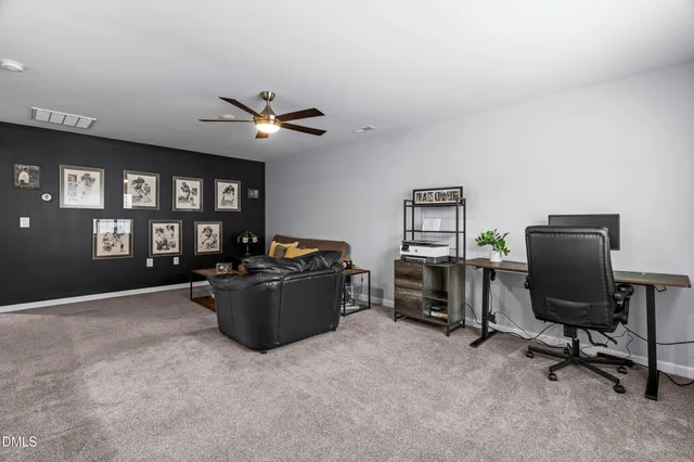 a view of a hallway with wooden floor and entryway