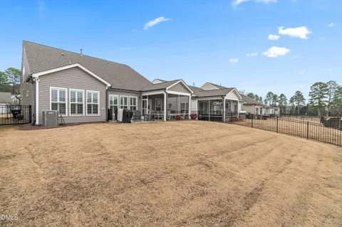 a view of a house next to a yard