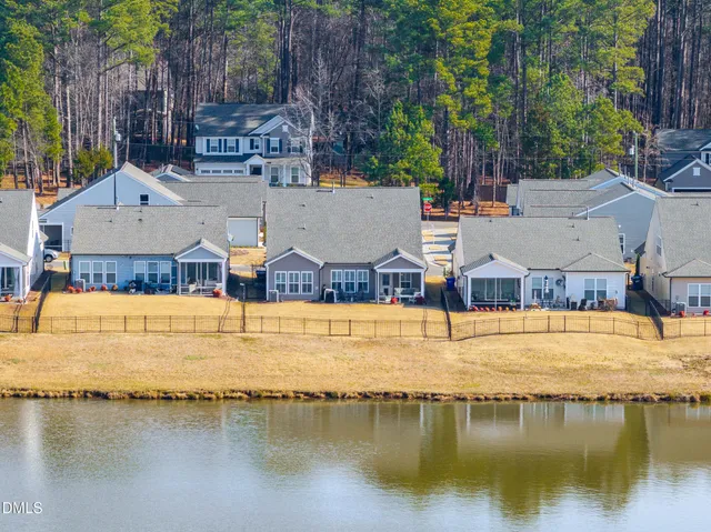 a view of residential houses with outdoor space and swimming pool