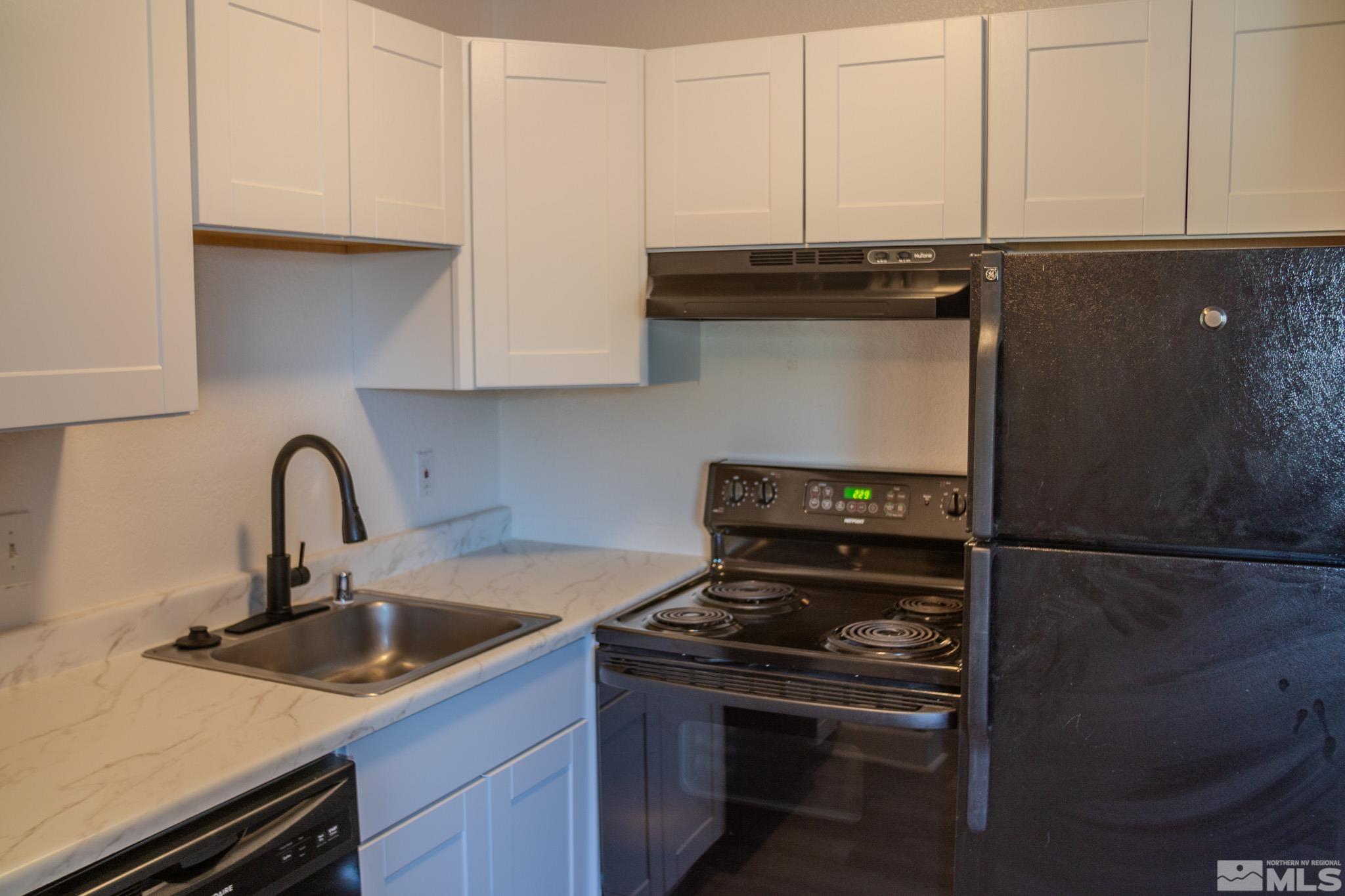 175 East Grove Street, Unit 30 Reno, NV 89502 - Photo 4 of 11 a kitchen with a sink and cabinets