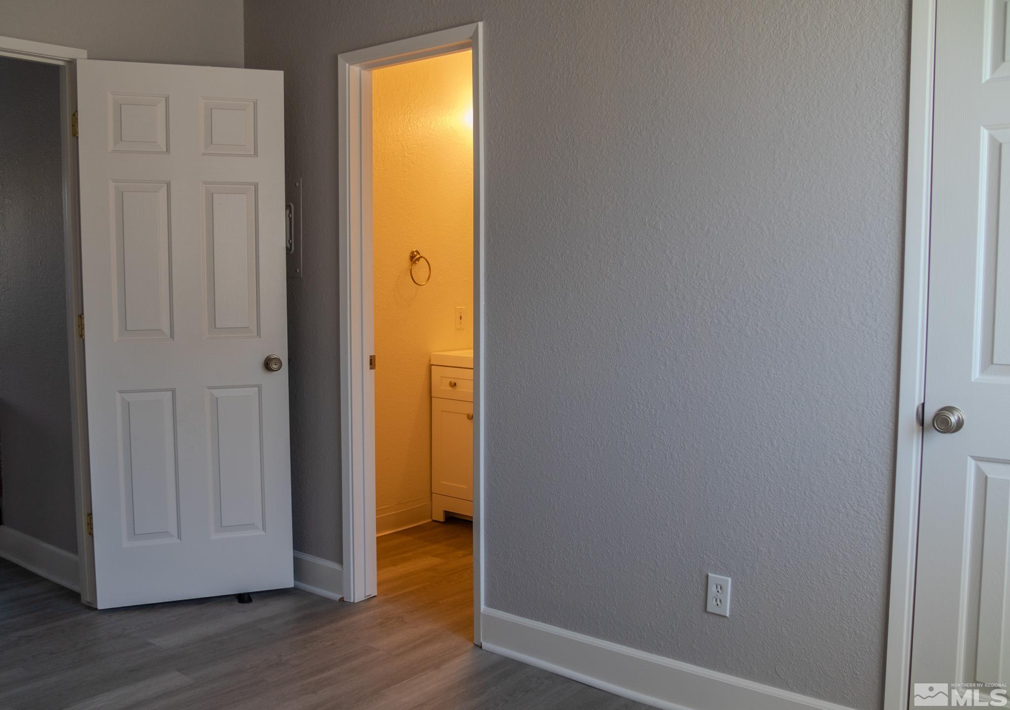 175 East Grove Street, Unit 30 Reno, NV 89502 - Photo 8 of 11 an empty room with wooden floor and closet