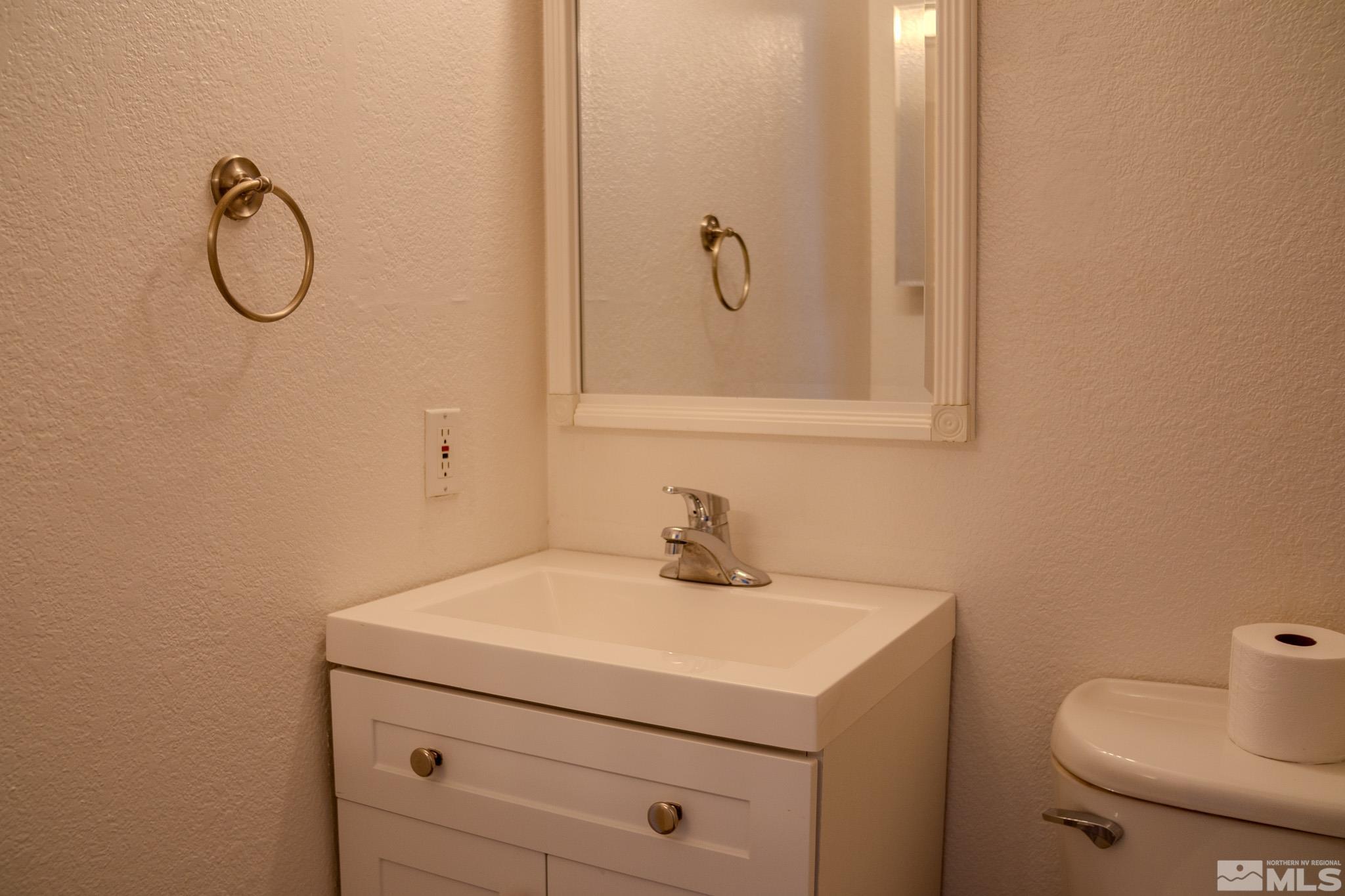 175 East Grove Street, Unit 30 Reno, NV 89502 - Photo 10 of 11 a bathroom with a sink a toilet and a shower