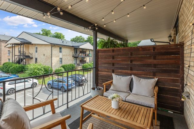 a view of balcony with furniture