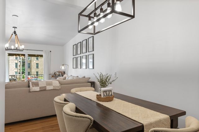a dining room with furniture and wooden floor