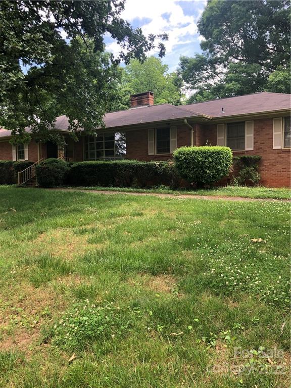 4208 Hyde Park Drive Charlotte, NC 28216 - Photo 2 of 4 a front view of house with yard and green space