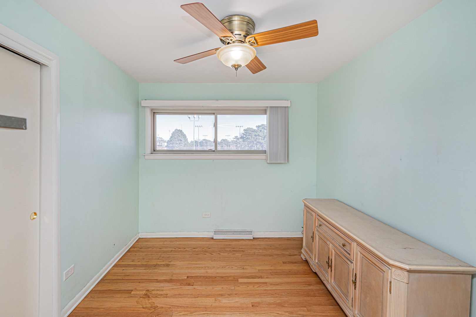 900 Devon Avenue Park Ridge, IL 60068 - Photo 11 of 30 a view of room with window and ceiling fan