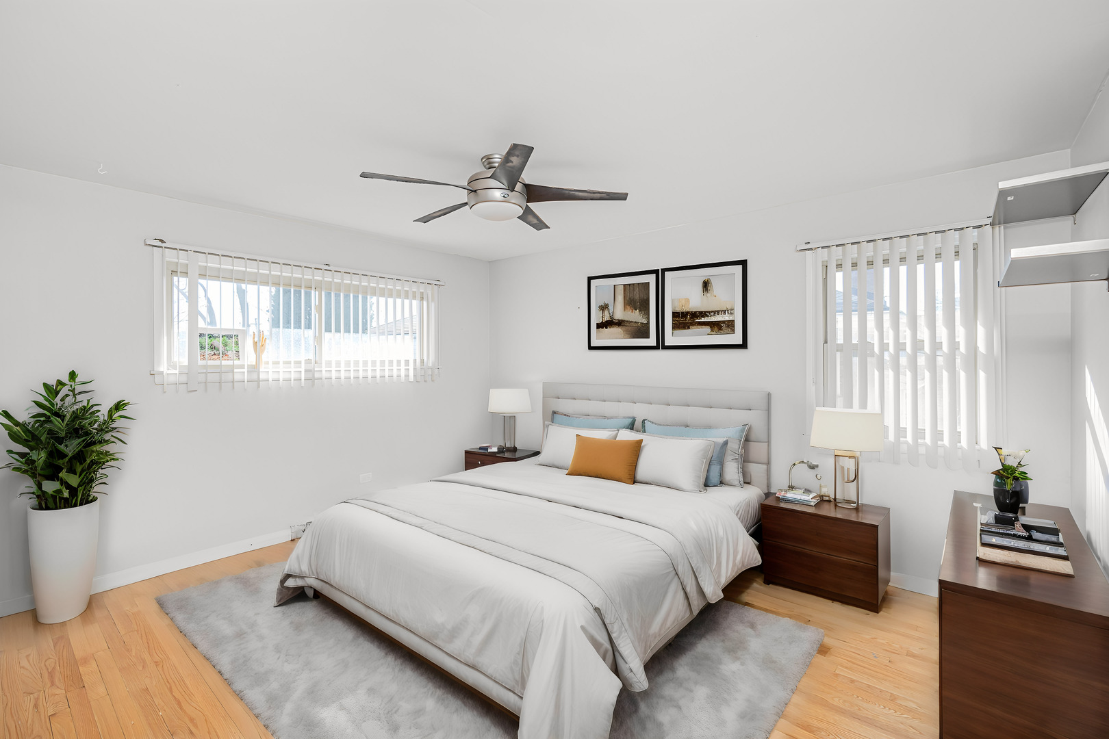 900 Devon Avenue Park Ridge, IL 60068 - Photo 15 of 30 a bedroom with a large bed and a potted plant