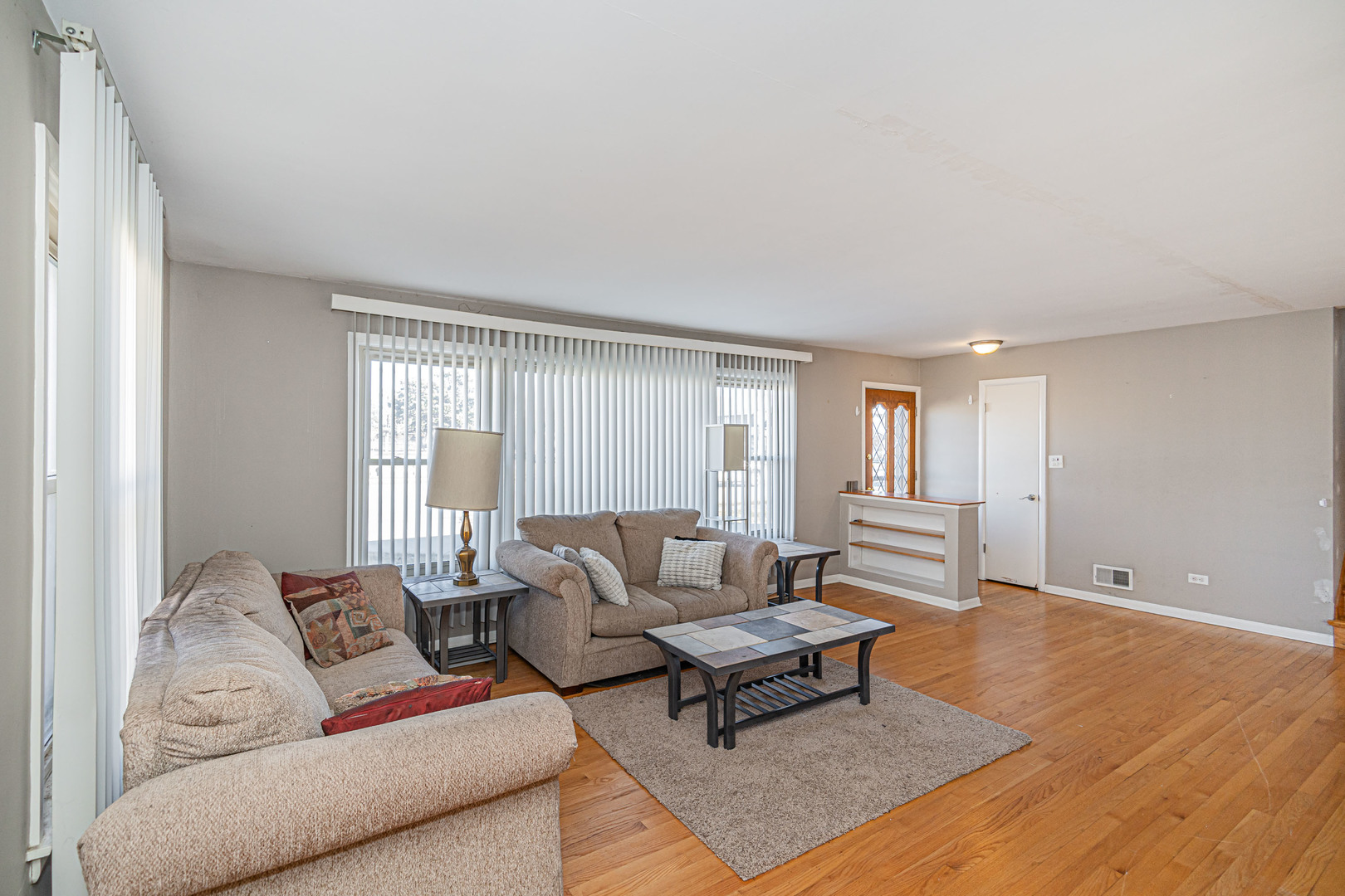 900 Devon Avenue Park Ridge, IL 60068 - Photo 3 of 30 a living room with furniture and a large window