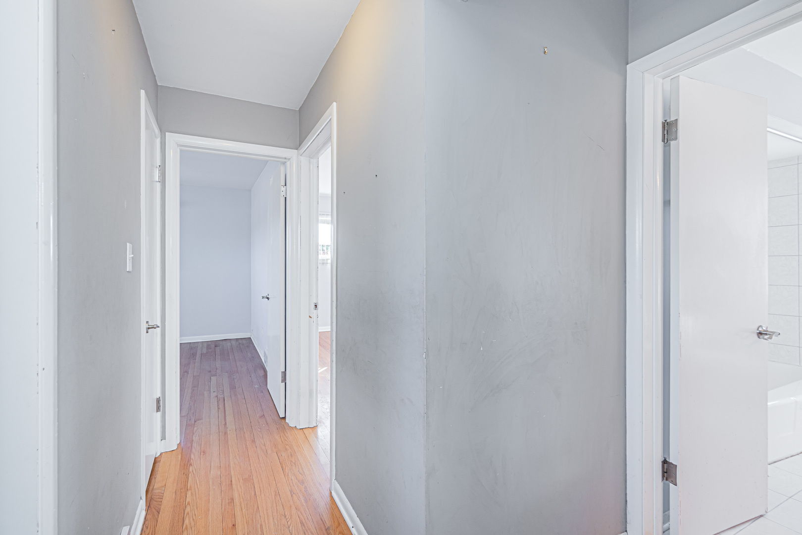 900 Devon Avenue Park Ridge, IL 60068 - Photo 10 of 30 a view of a hallway with wooden floor
