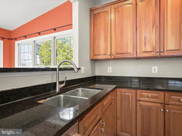 a bathroom with a sink a mirror and a toilet