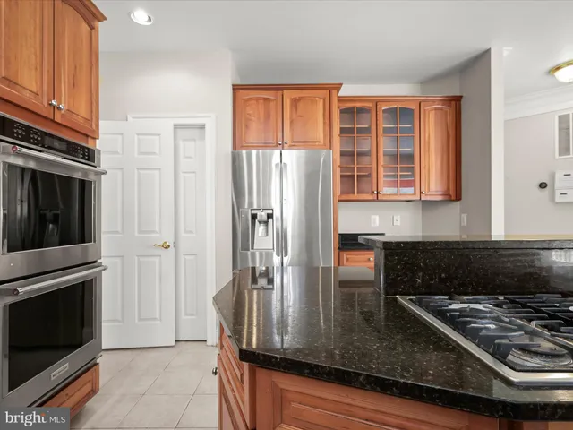 a spacious bathroom with a granite countertop tub sink and mirror