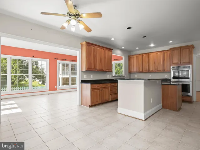 a bathroom with bathtub and window