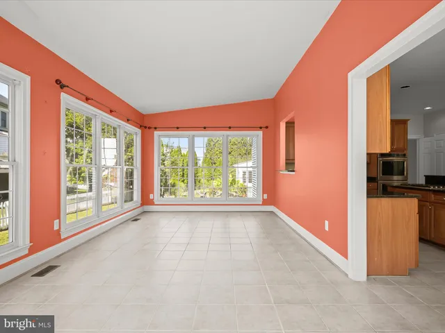 a bathroom with a sink a light fixture and a mirror