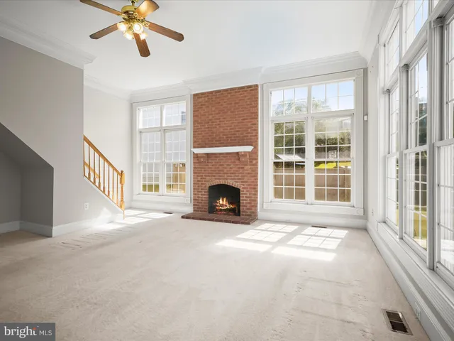 a view of an empty room with a kitchen
