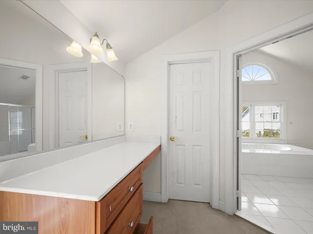 a view of brick building with a yard