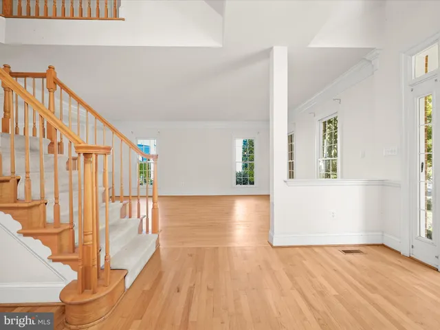 a kitchen with stainless steel appliances granite countertop a stove top oven a sink dishwasher and a refrigerator