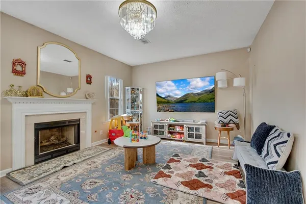 a living room with furniture and a fireplace