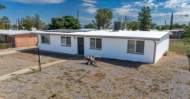 a house view with a backyard space
