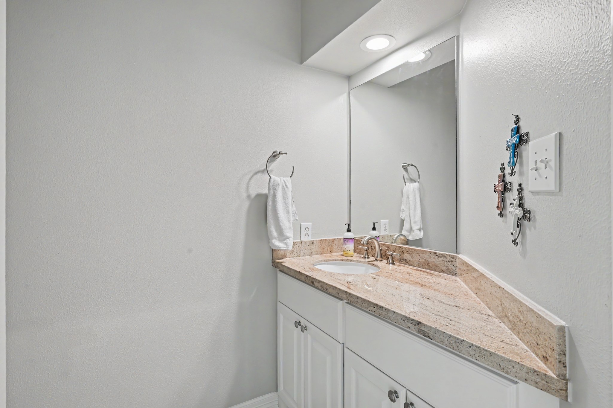 14938 Codys Run Cypress, TX 77429 - Photo 23 of 50 The half bath has a large vanity with granite counter tops, and plenty of cabinet space for storage. It is convenient to the living area on the first level.